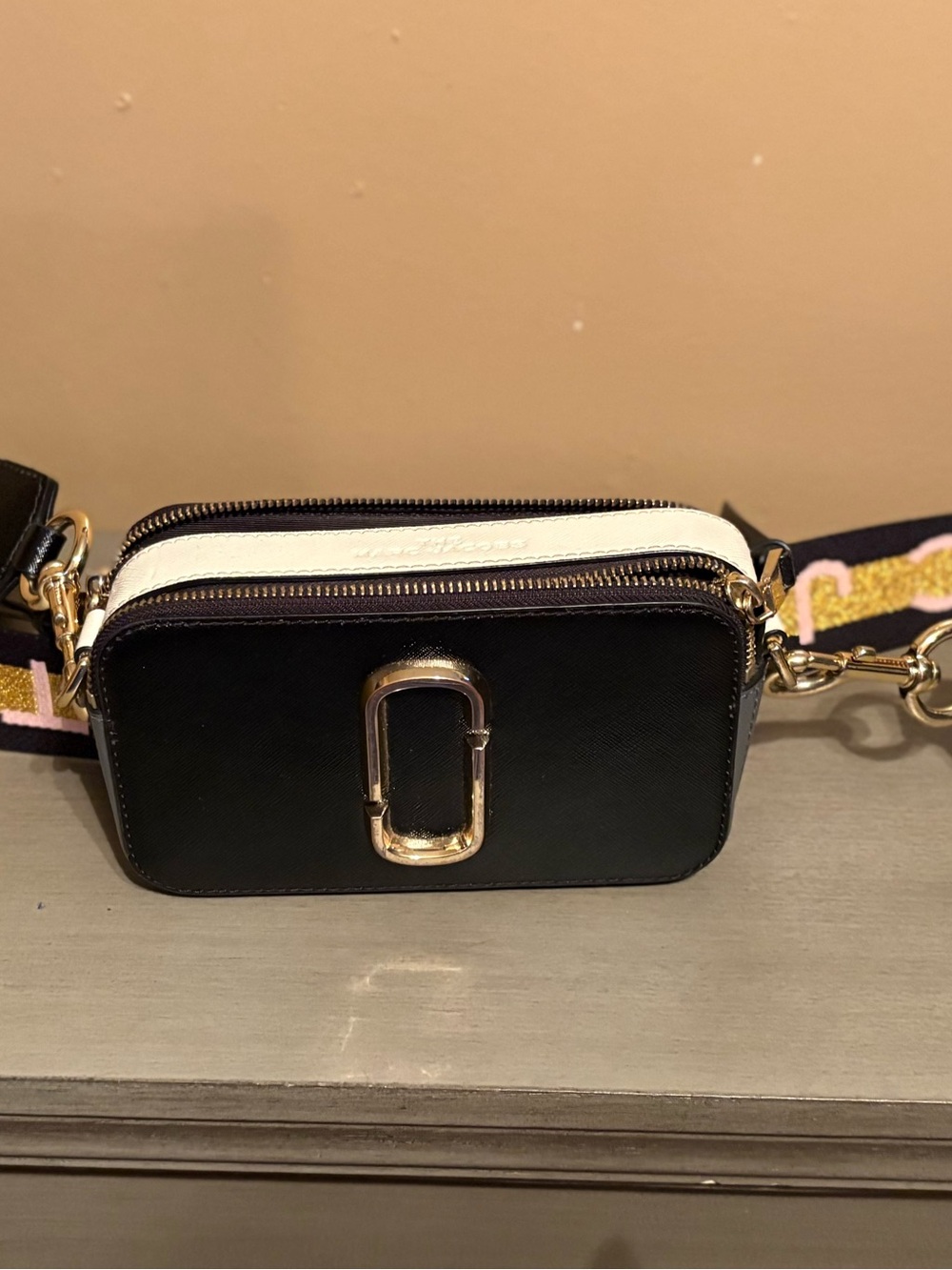 Black and White Crossbody Camera Bag with Gold Hardware